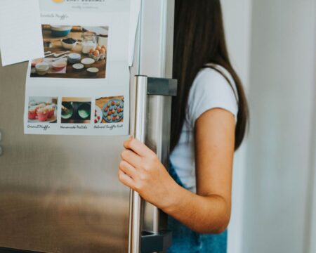 girl opening fridge easy meals for kids Motherly