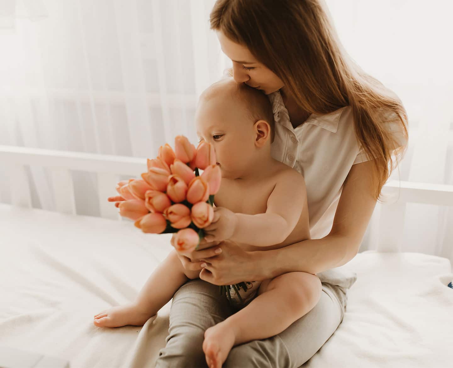 mom and baby with flowers - birth flowers by month