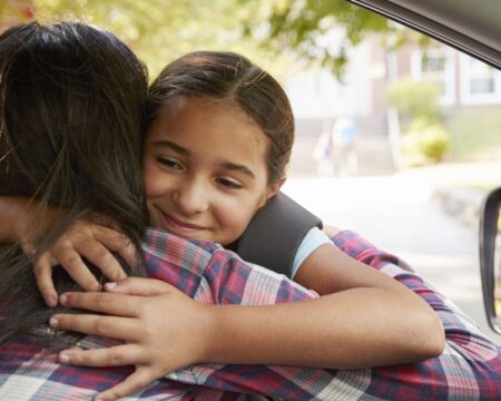 mom saying goodbye to her daughter at school drop off and pick up Motherly