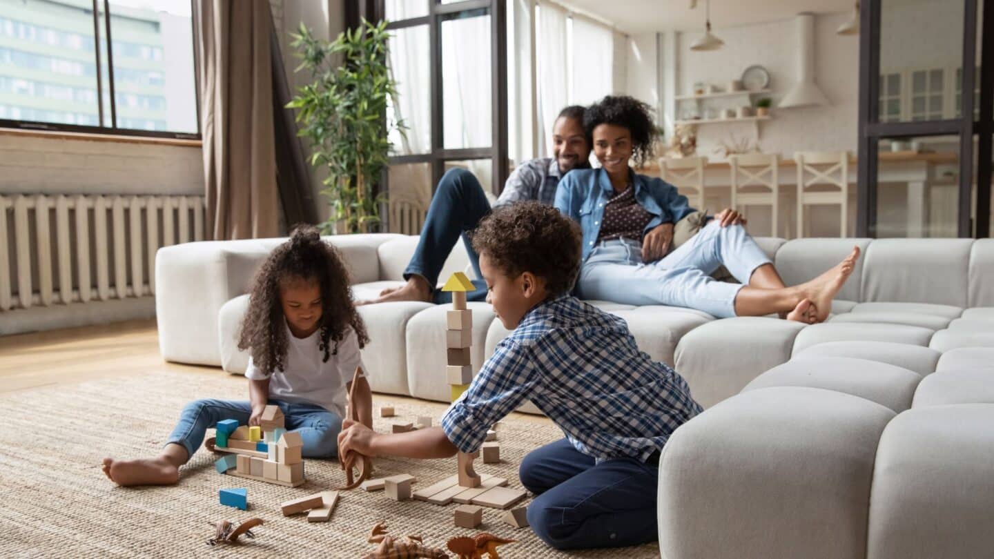 Free Photo  Mother and father playing with son or daughter in rocking  chair on light room floor with kitchen set on background, happy family  spending time together, playing with baby.