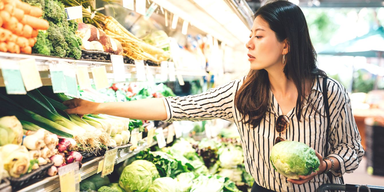 woman shopping for groceries after update from fda new definition of healthy