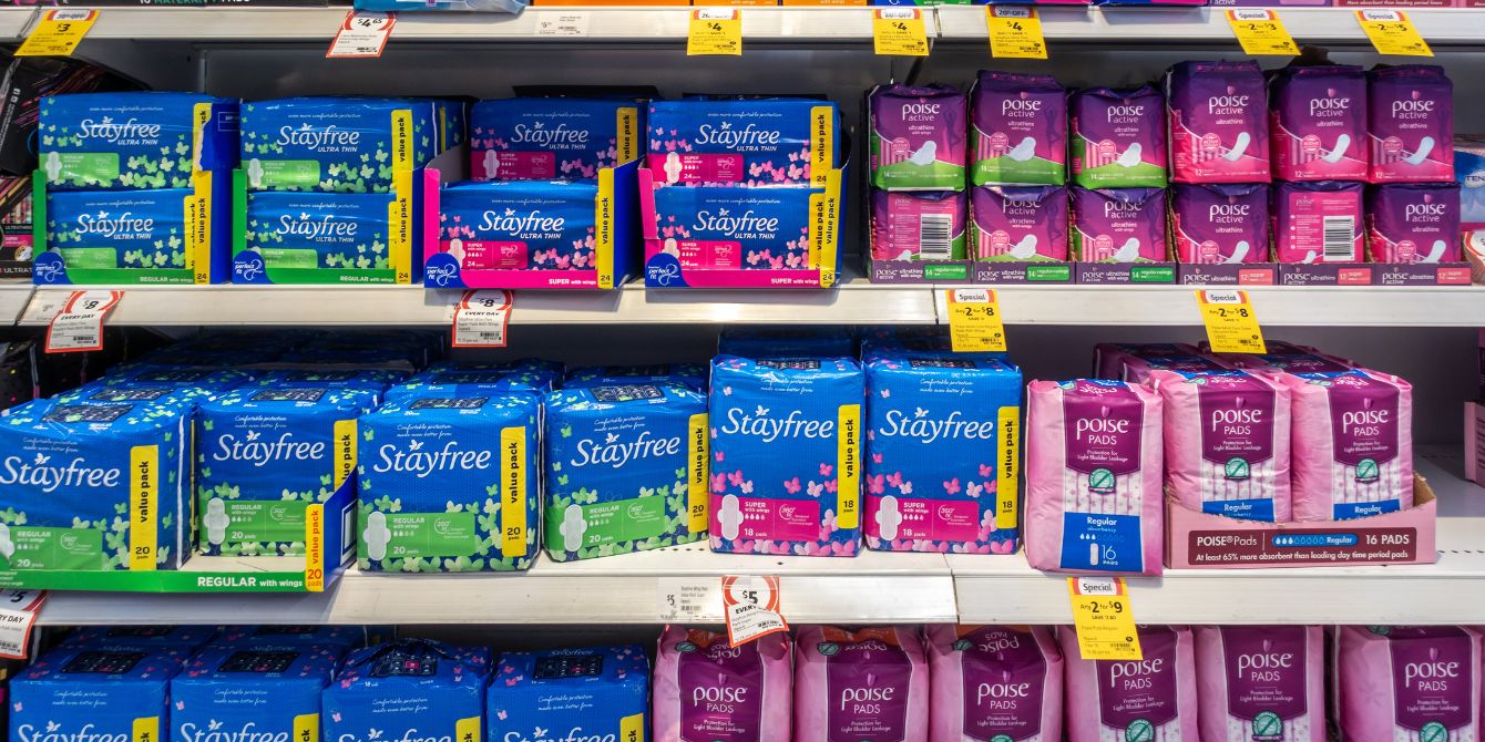 Pads and tampons on store shelves - CVS eliminating pink tax