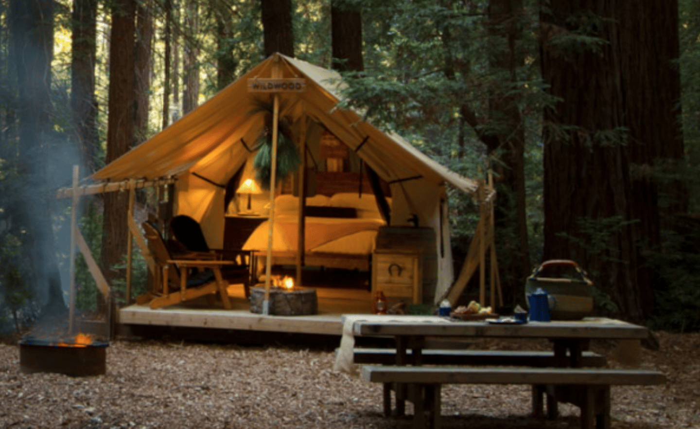 Tent and picnic table at Ventana Big Sur, a family glamping location