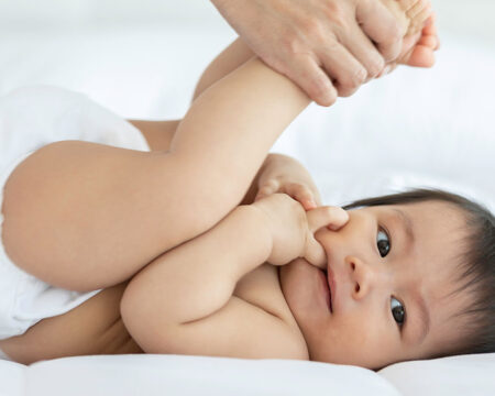 baby getting an infant massage at home