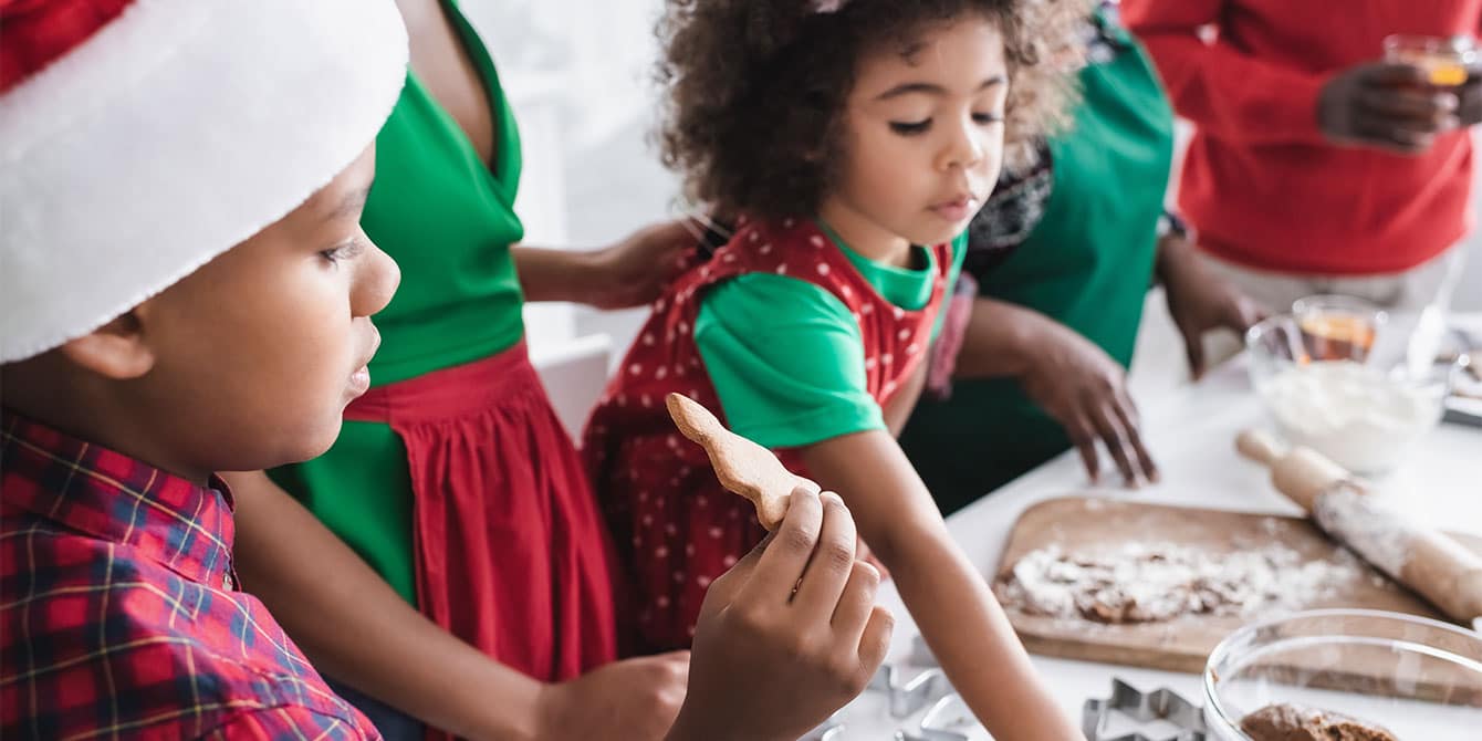 family baking for christmas in the kitchen, in defense of a messy house