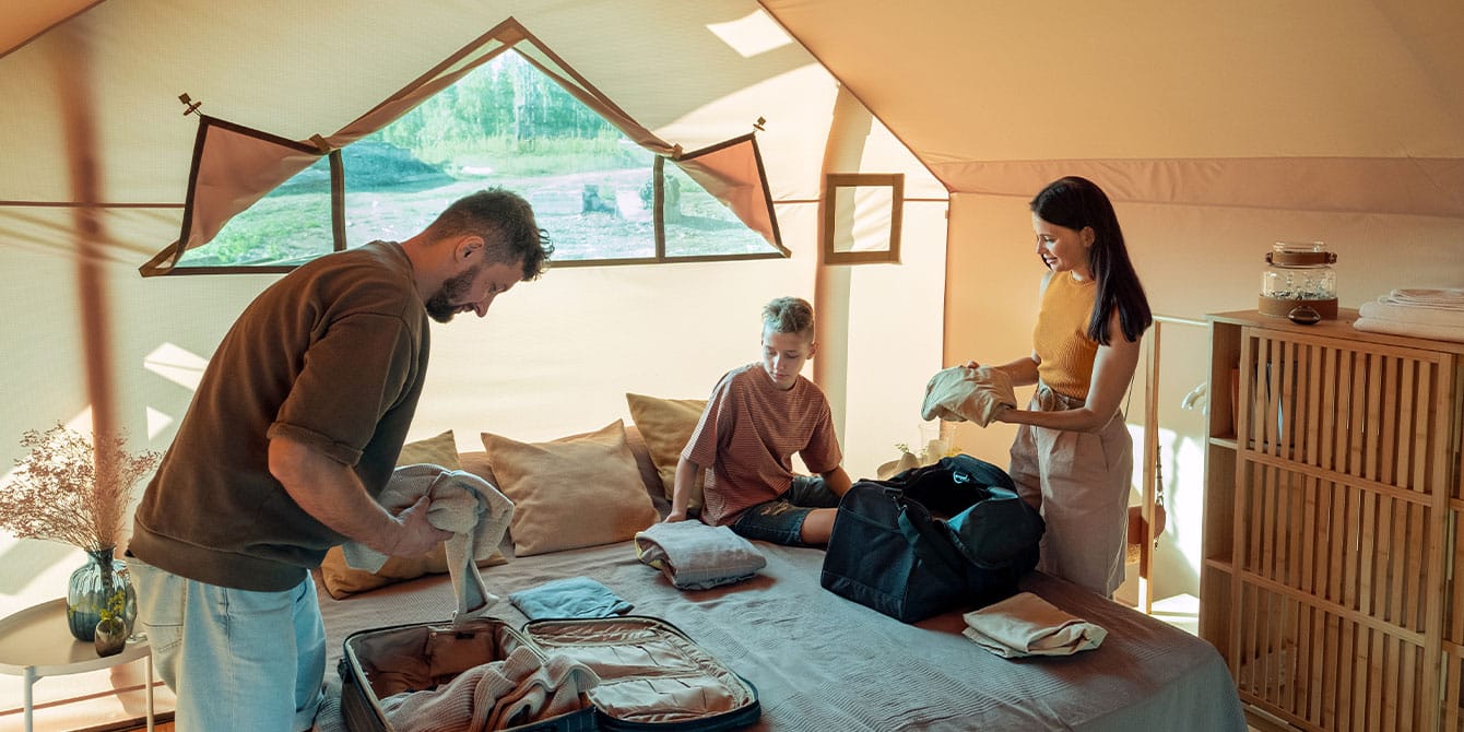 Family unpacks while on a family glamping trip