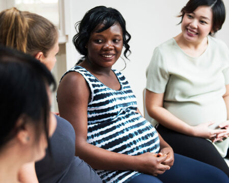 group of pregnant women talking Motherly