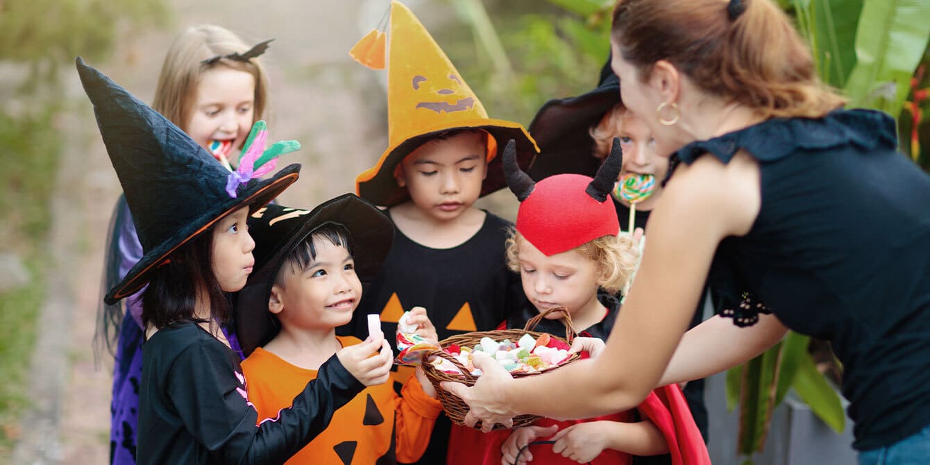 kids trick-or-treating to celebrate halloween