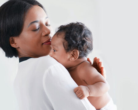 mom burping newborn