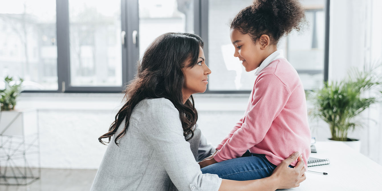 mom talking with kid offering step-parent advice