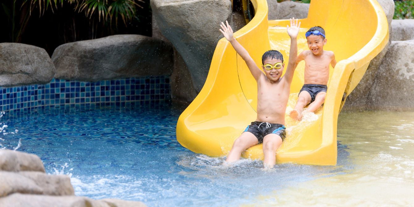 two boys on water slide- family water park resorts
