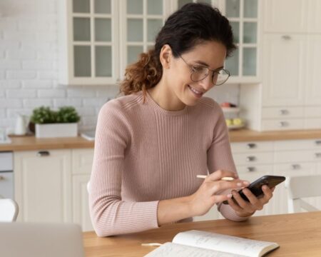 woman on phone - family calendars