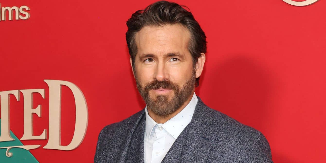 Ryan Reynolds posing on the red carpet for 'Spirited' Nov. 2022