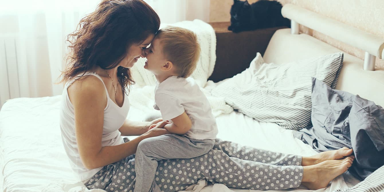 Mother relaxing with son at home - how to choose a guardian for your child