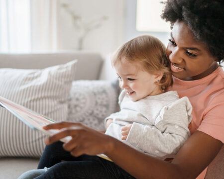 babysitter reading to toddler