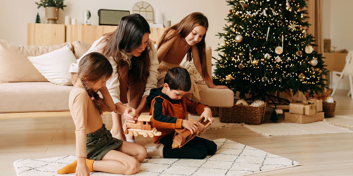 family spending christmas morning together setting boundaries during the holidays