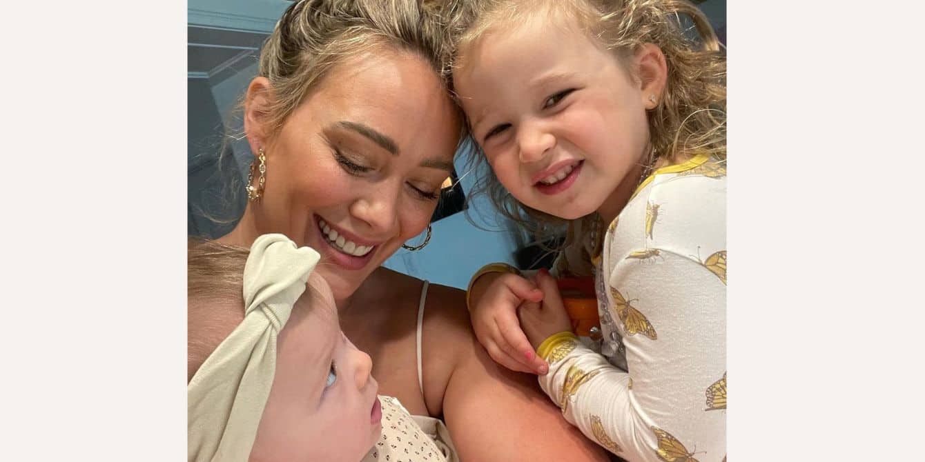 Hilary Duff poses for Instagram while holding her two daughters