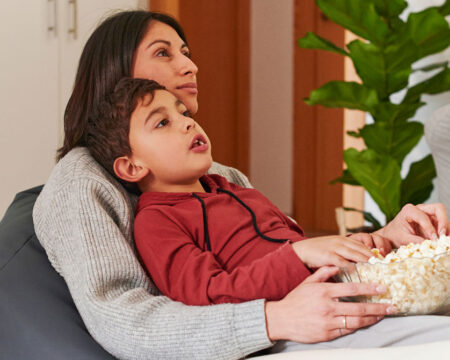 mom and son eating a snack together Motherly