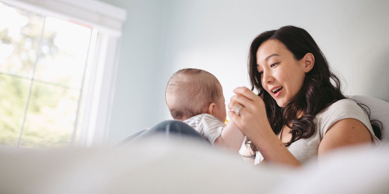 young mom playing with baby as a single mom