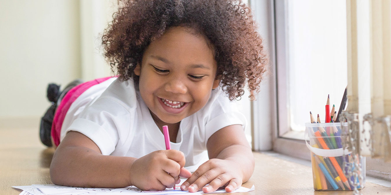 young girl doing some dragon coloring pages