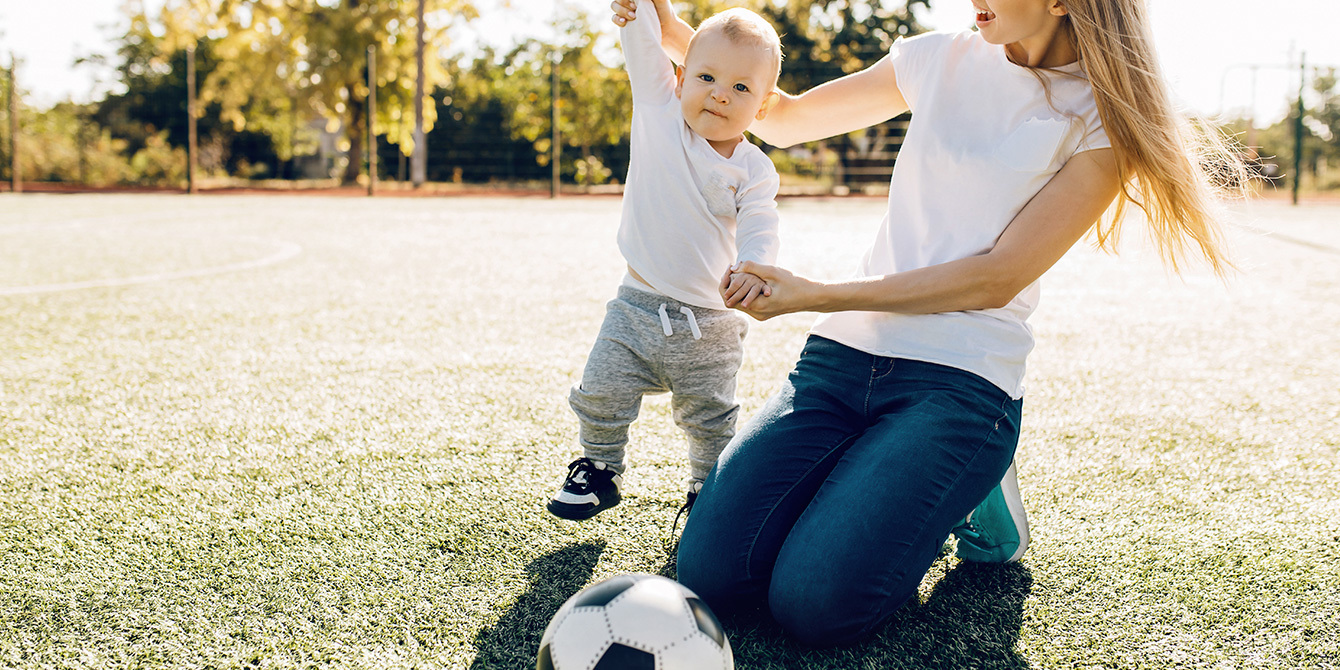 mom and son playing soccer- sporty baby names