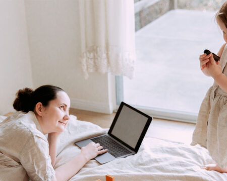 woman looking and admiring her daughter