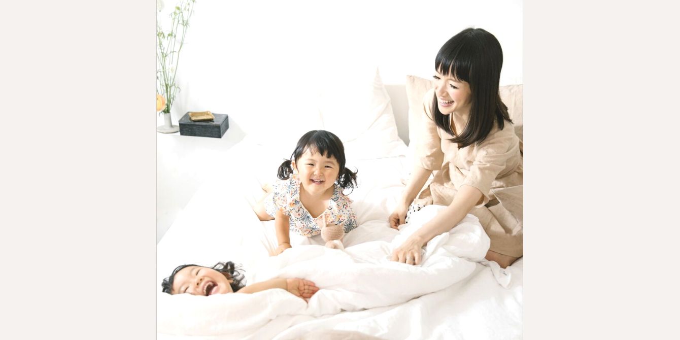 Marie Kondo playing with her children