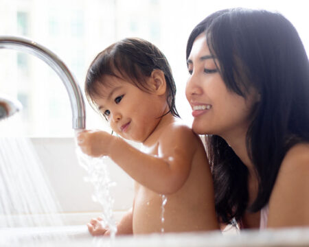 mom and baby taking a bath together