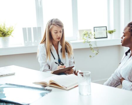 woman meeting with doctor in office