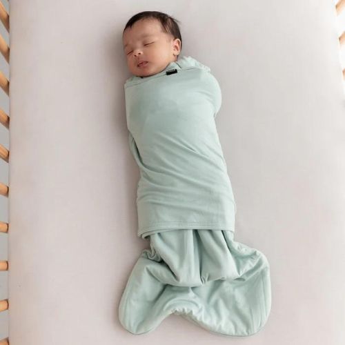 Baby sleeping in a Kyte baby swaddle