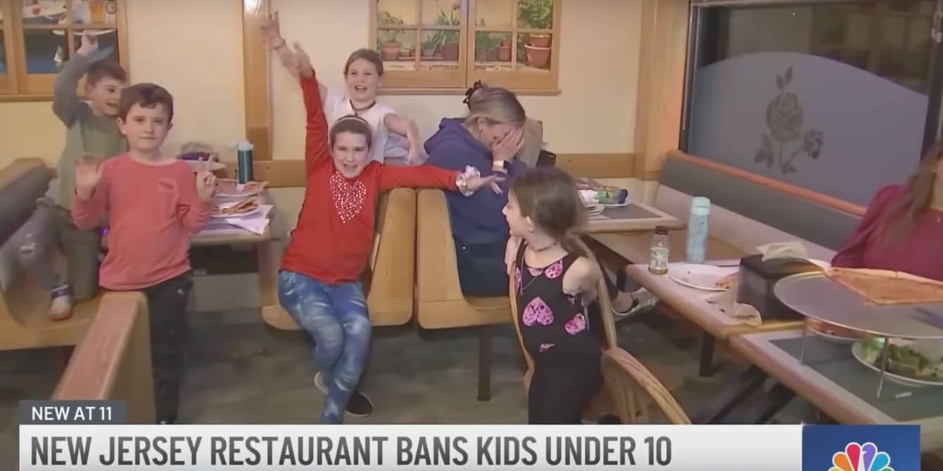 A group of kids eating in a restaurant - restaurant bans kids