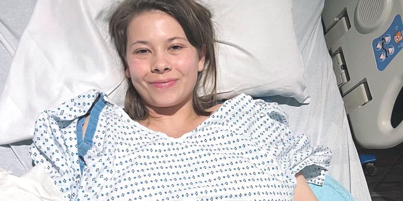 Bindi Irwin lying in hospital bed