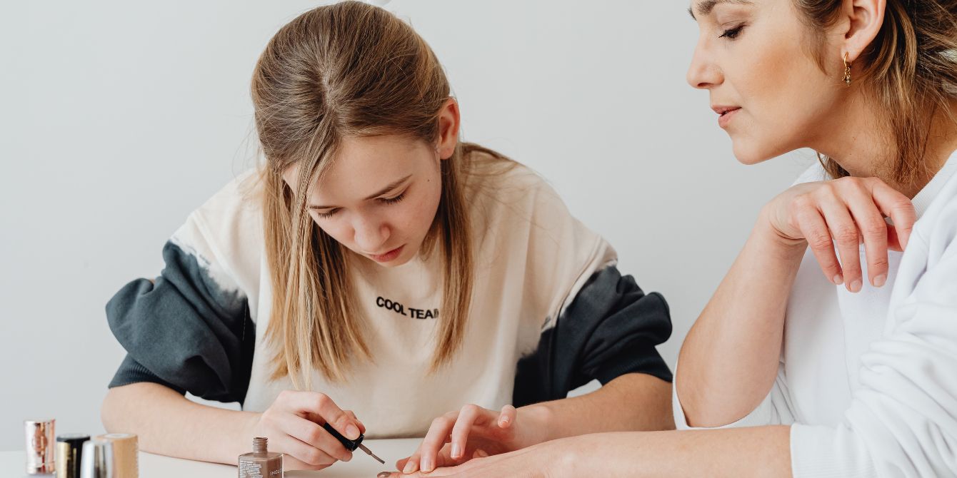 daughter paints mom's nails - starting hpv vaccine early at age 9