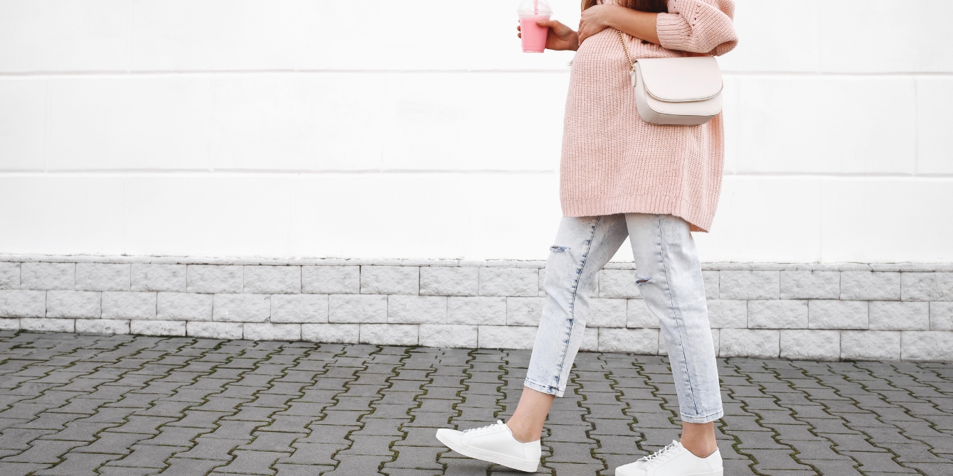 pregnant woman walking down the street - curb walking to induce labor