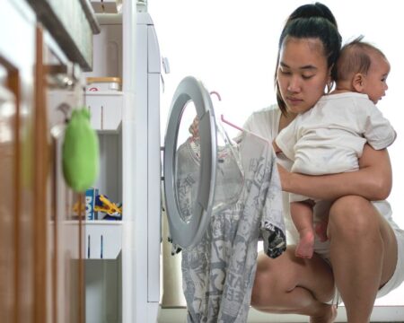 mom doing housework with baby Motherly