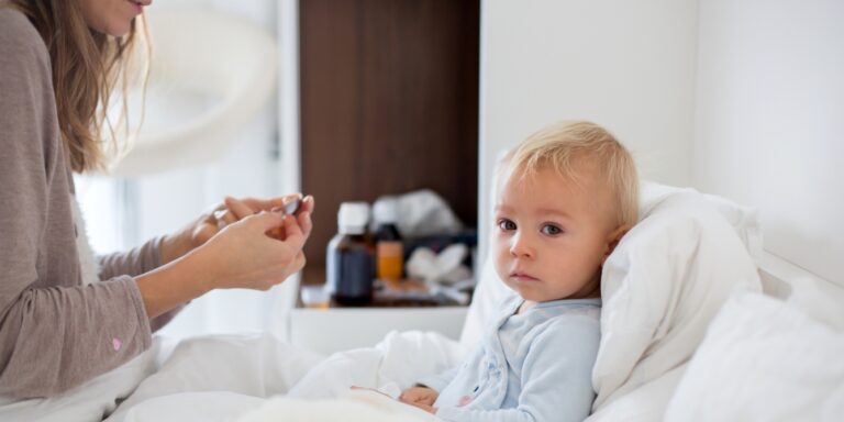 child with stomach virus waiting to take medicine - shigellosis in kids