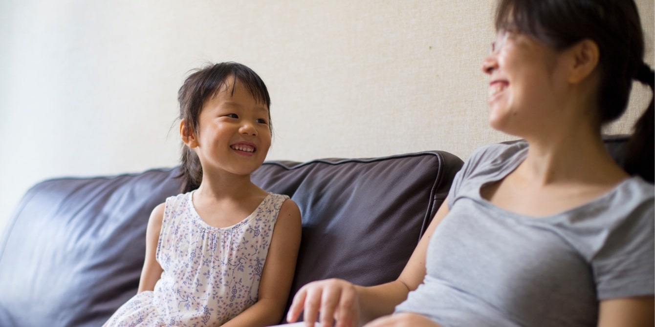 a former teacher who is a mom laughing with her daughter