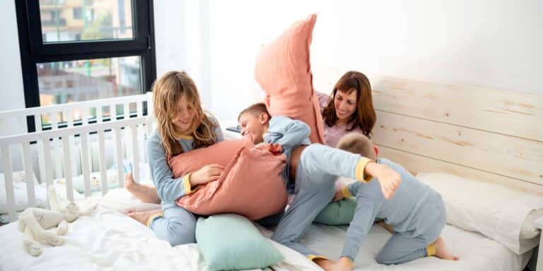 mom and kids having a pillow fight- mother's day activities