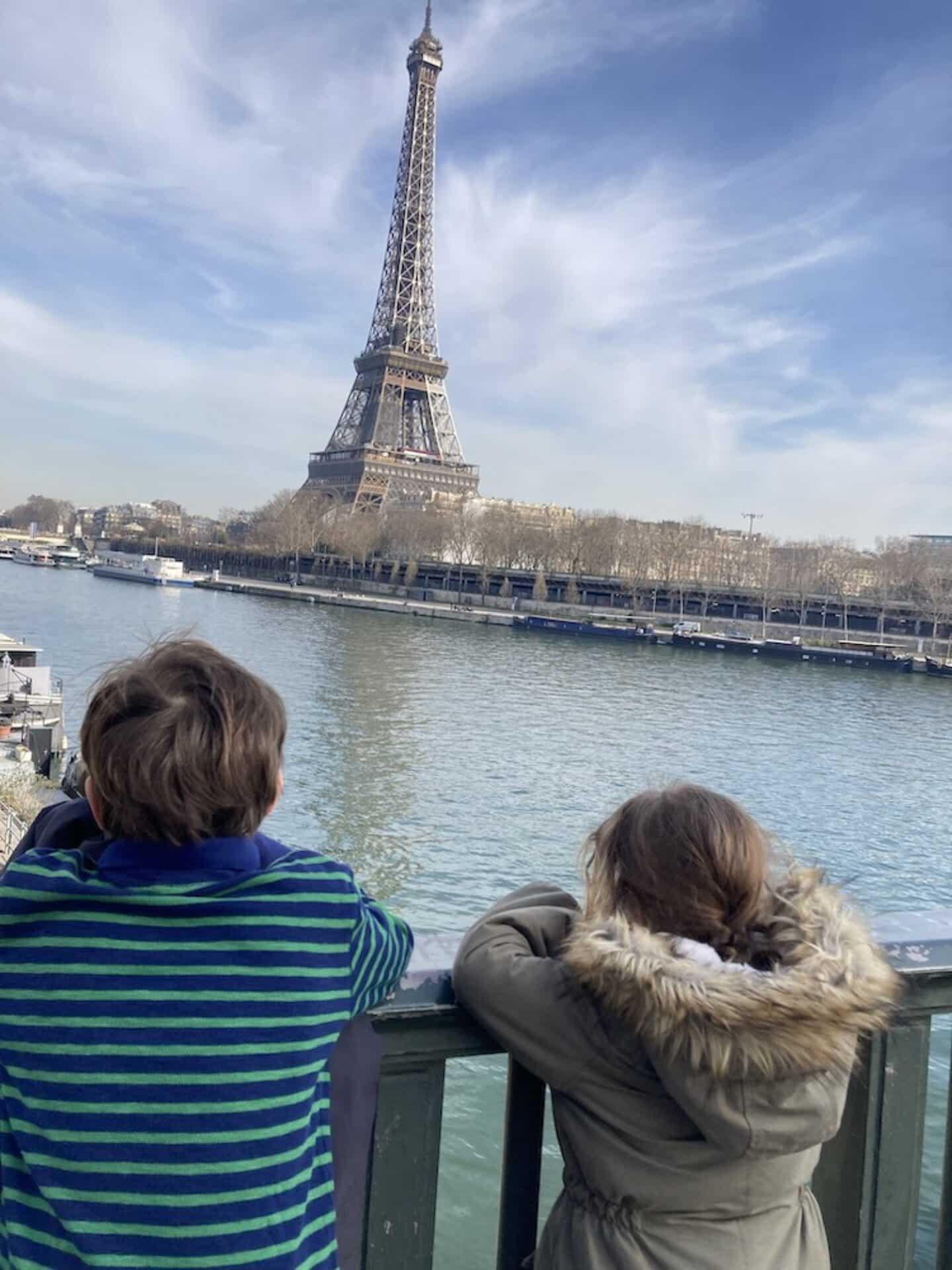 How traveling with kids can reshape your view on motherhood Juliets kids looking at tour eiffel