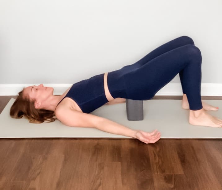 YogaSix - Supported Bridge Pose for postpartum yoga