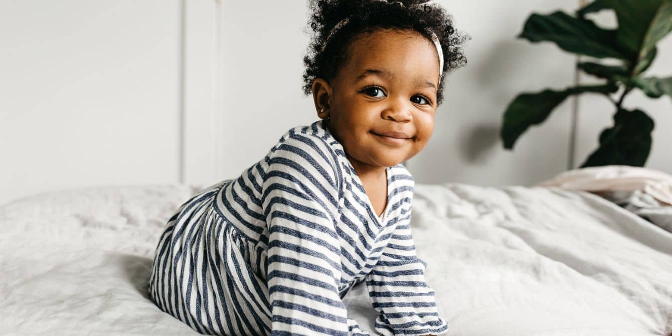 cute toddler crawling on bed - 2-year-old milestones