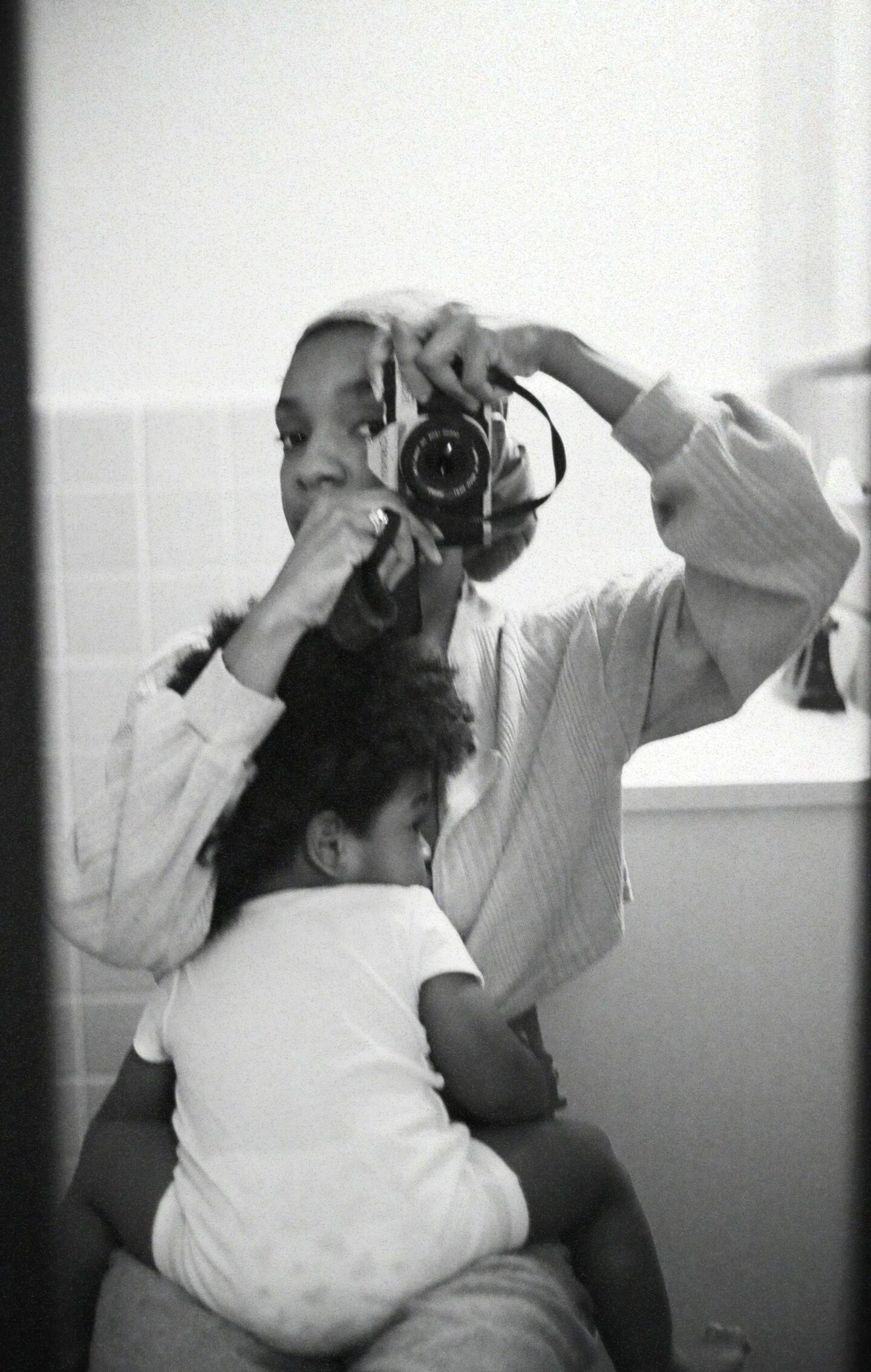 mother taking photo with baby Motherly