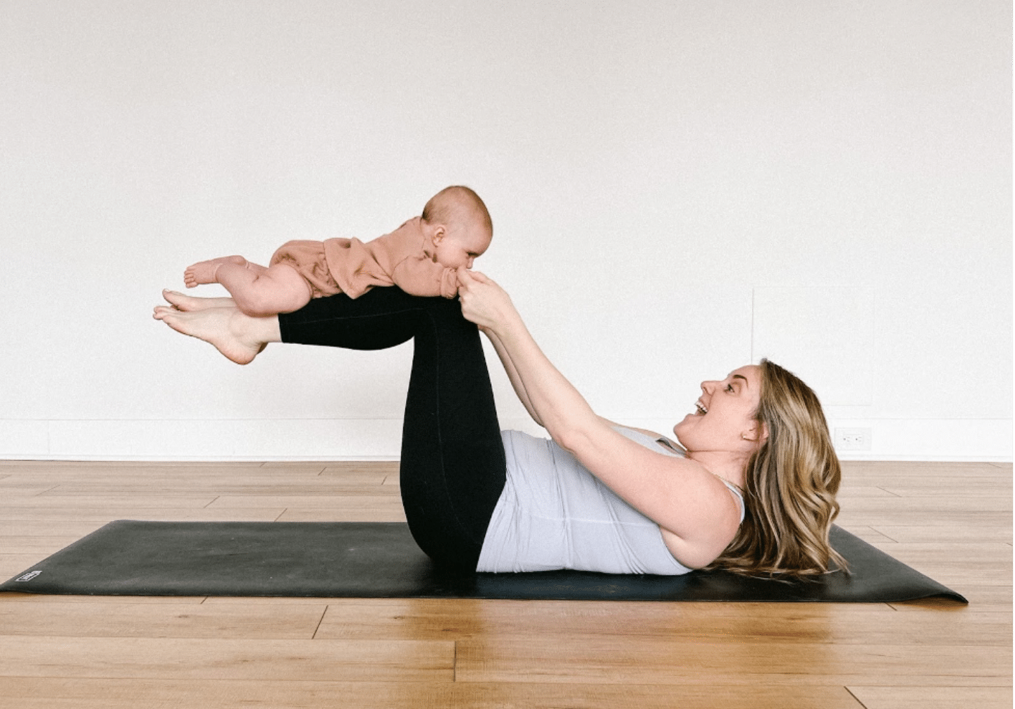5 Yoga with Baby Poses to Try Postpartum - Motherly