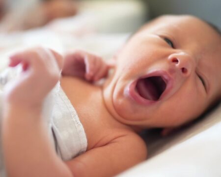 newborn baby yawning Motherly