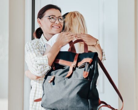 mom hugging daughter going to college Motherly