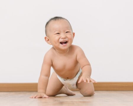 one year old boy crawling on floor Motherly