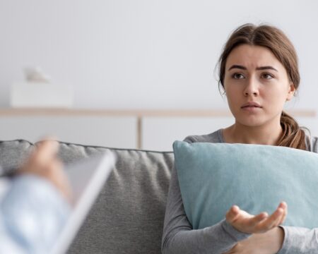 young woman at doctors visit confused Motherly