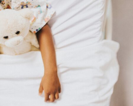 cropped child in hospital bed Motherly