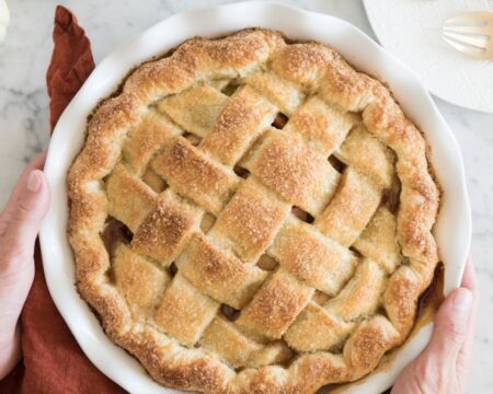 hands holding apple pie- what to make with apples