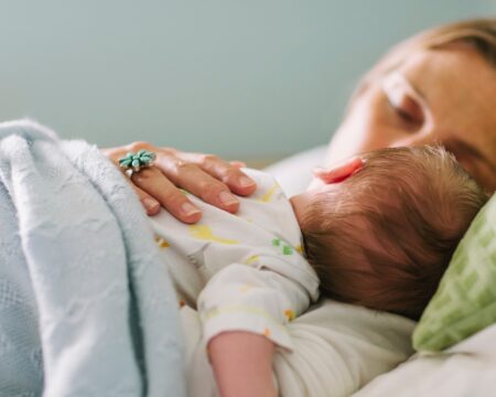 mother with baby on her chest taking nap Motherly